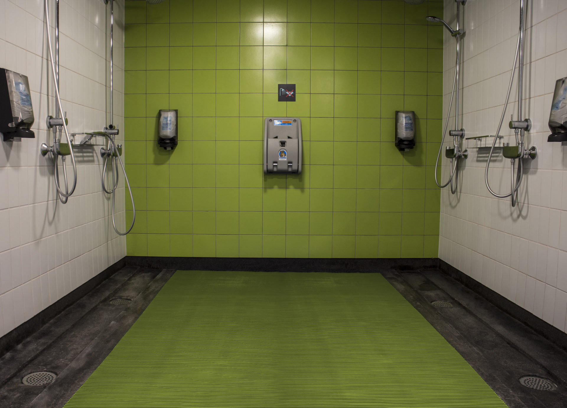 Green mat in shower area
